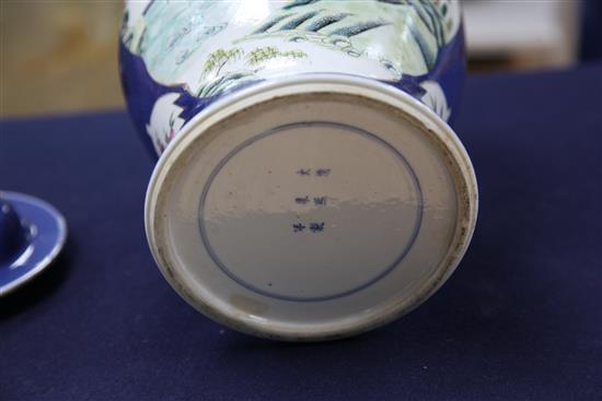 A pair of Chinese famille rose powder blue ground jars and covers, Kangxi marks, early 20th century, height 31.5cm